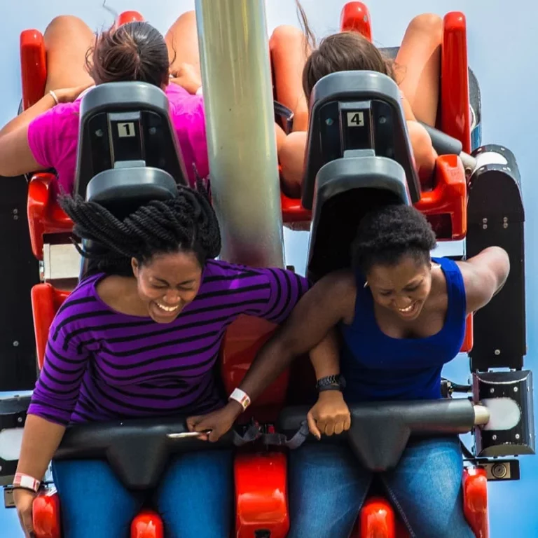 Two women having fun on a rollercoaster